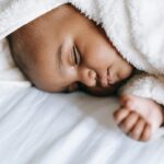 Can Newborn Sleep In Footie Pajamas? [3 Considerations]